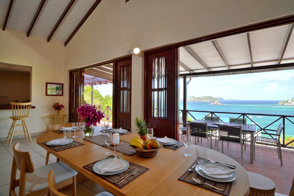 Dining Table Villa Marisol dining table set for guests with turquoise bay view